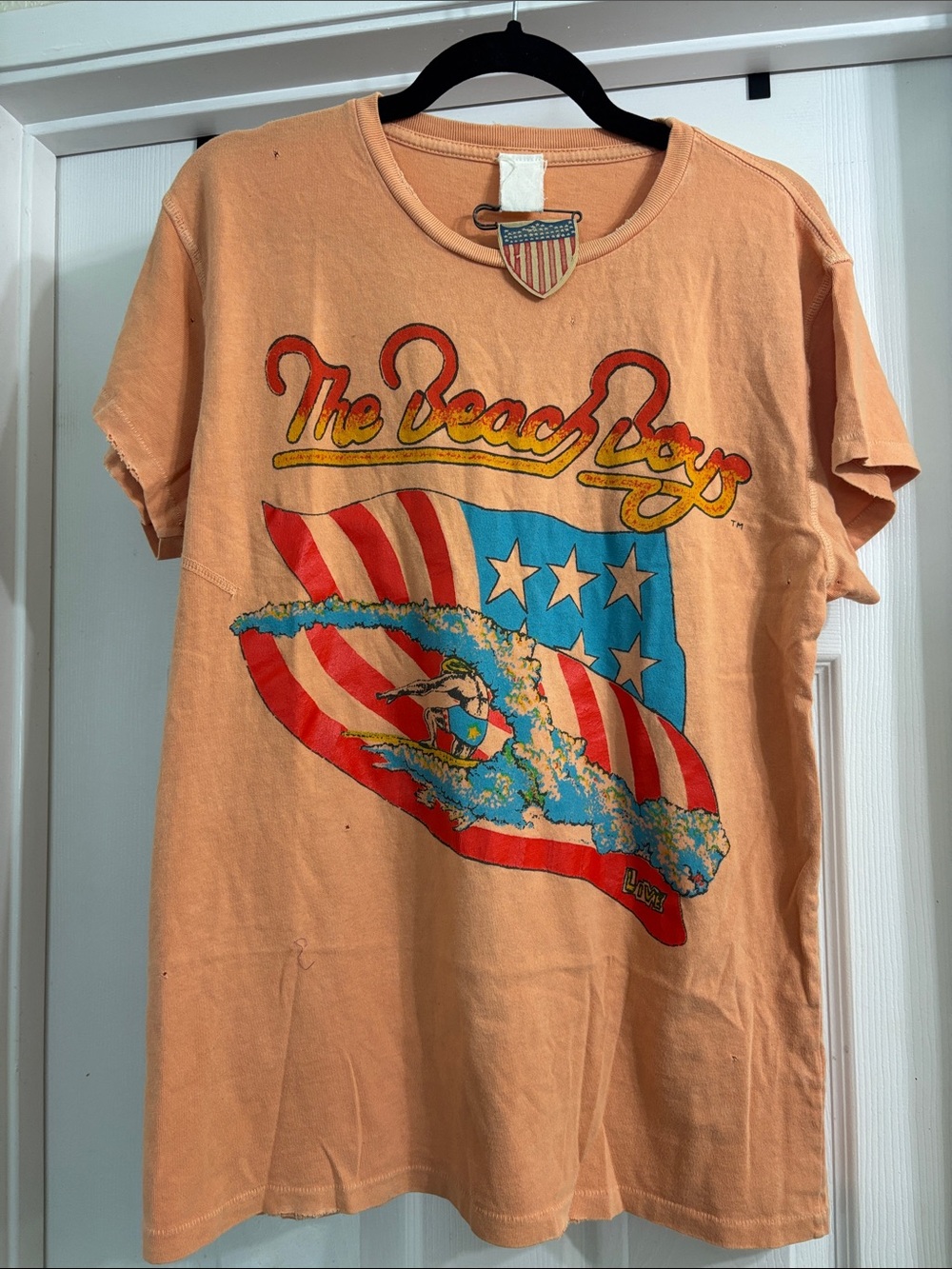 MadeWorn The Beach Boys Graphic Tee in Peach with Red, Blue and Yellow Print